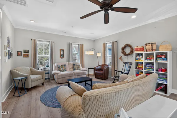 a front view of a house with a yard table and chairs