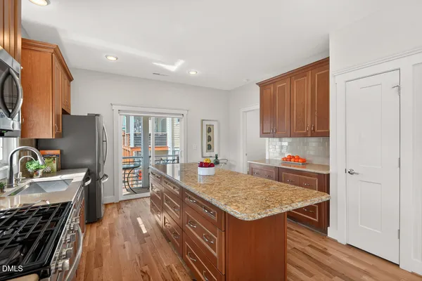 a view of kitchen and wooden floor