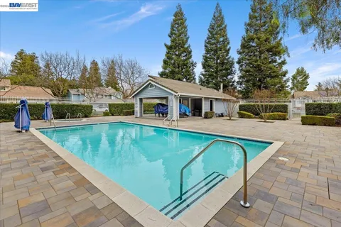 a view of a house with swimming pool