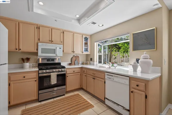 a kitchen with a sink stove and microwave