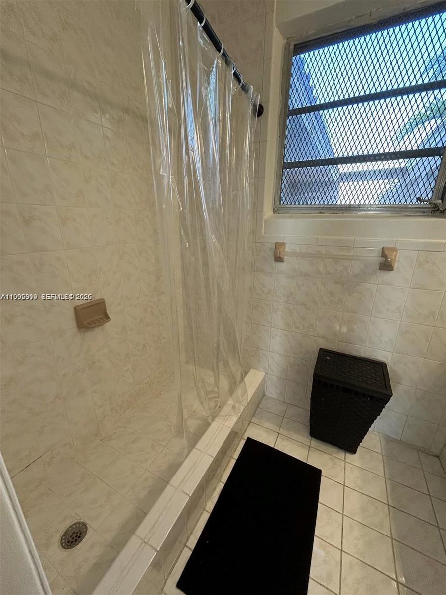 9525 Southwest 16th Street, Unit A Miami, FL 33165 - Photo 6 of 7 a bathroom with a shower