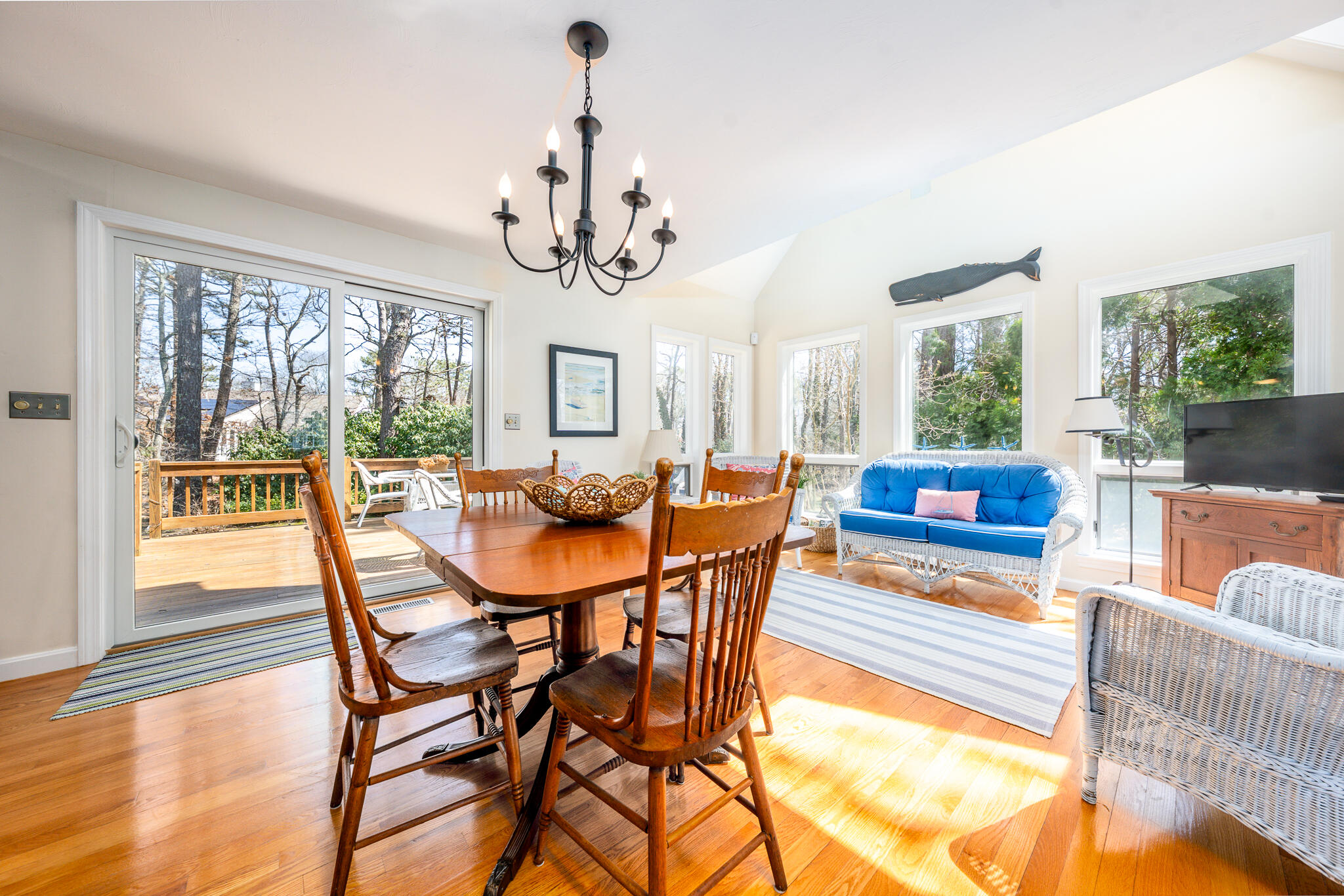 42 Eventide Lane Hyannis, MA 02601 - Photo 6 of 39 a view of a dining room with furniture wooden floor and chandelier