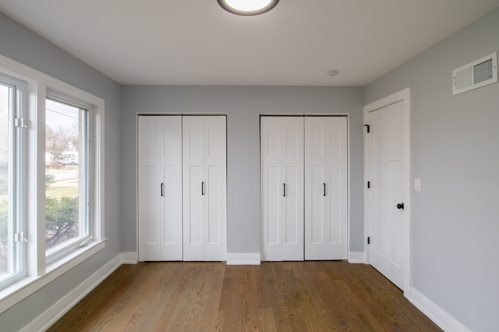1241 Deerfield Road Deerfield, IL 60015 - Photo 14 of 37 a view of an empty room with wooden floor and a window