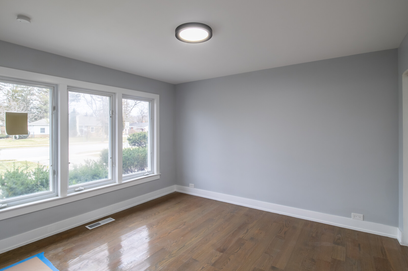 1241 Deerfield Road Deerfield, IL 60015 - Photo 21 of 37 an empty room with wooden floor and windows