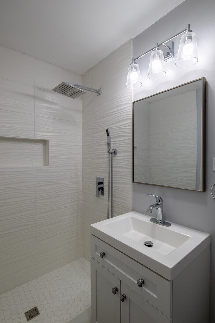 1241 Deerfield Road Deerfield, IL 60015 - Photo 22 of 37 a bathroom with a sink and a mirror