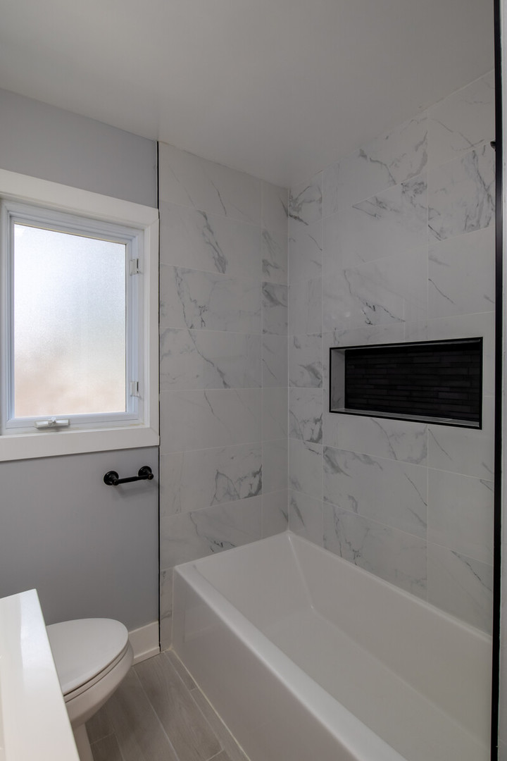 1241 Deerfield Road Deerfield, IL 60015 - Photo 23 of 37 a bathroom with a bathtub and a toilet