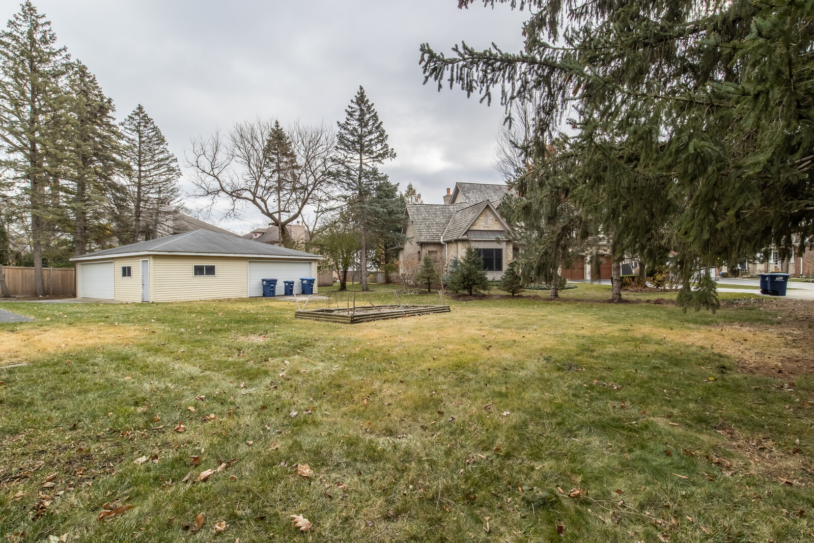 1241 Deerfield Road Deerfield, IL 60015 - Photo 36 of 37 a view of a large house with a big yard and large trees