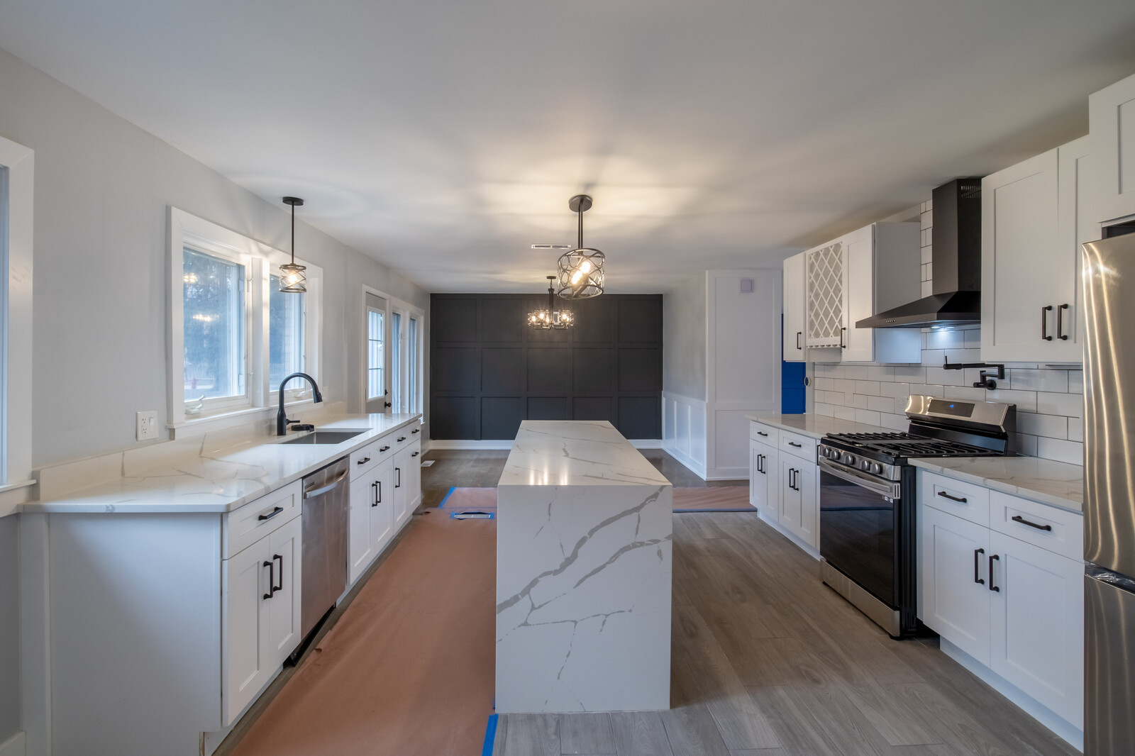 1241 Deerfield Road Deerfield, IL 60015 - Photo 7 of 37 a large kitchen with stainless steel appliances lots of counter space and wooden floor