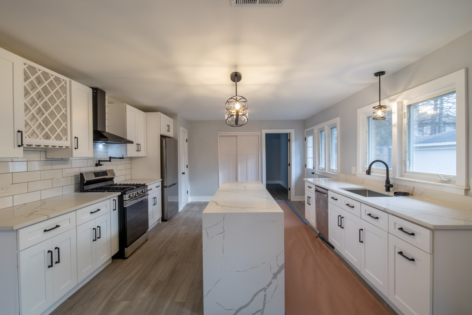 1241 Deerfield Road Deerfield, IL 60015 - Photo 10 of 37 a large kitchen with stainless steel appliances granite countertop a sink stove and refrigerator