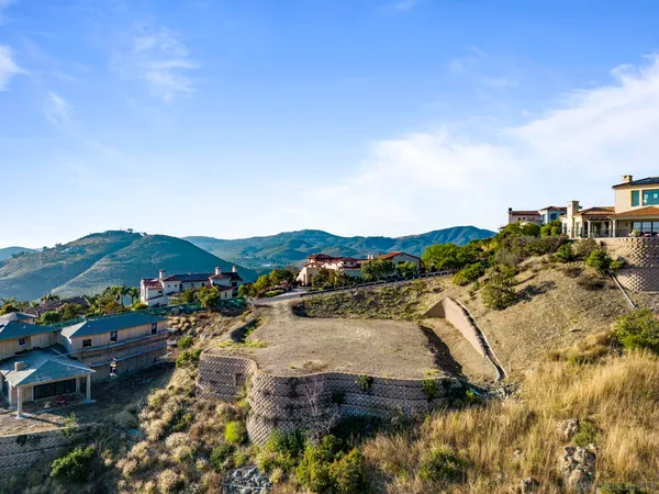 a view of a town with mountains in the background