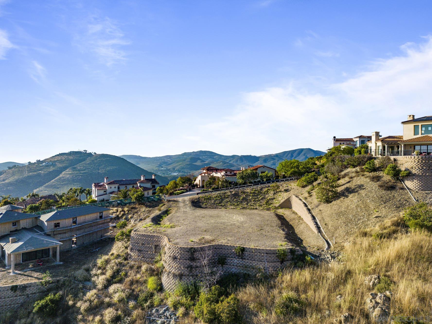 0 Camino De Arriba, Unit 148 Rancho Santa Fe, CA 92067 - Photo 3 of 17 a view of a town with mountains in the background