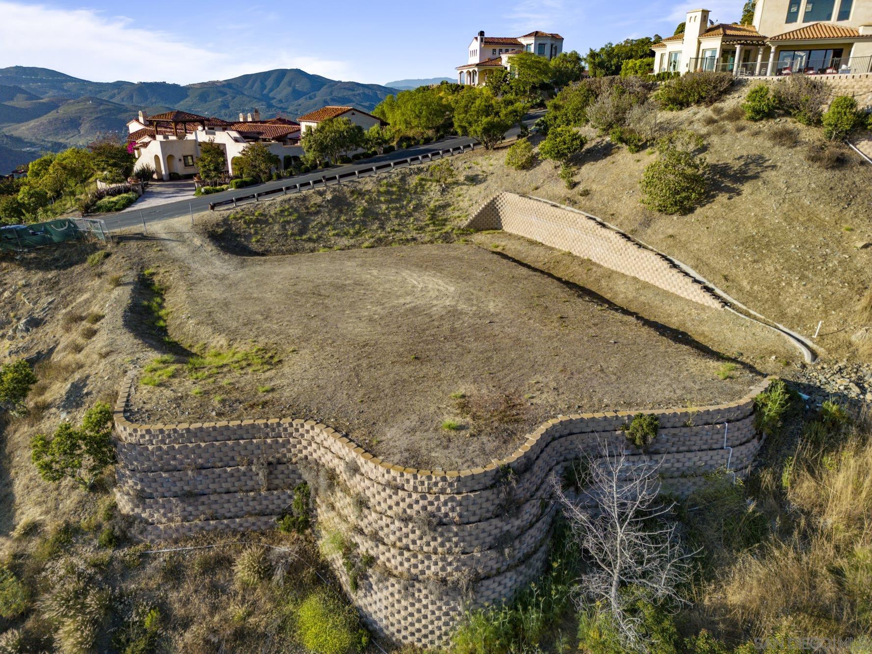 0 Camino De Arriba, Unit 148 Rancho Santa Fe, CA 92067 - Photo 5 of 17 a view of a house with a yard