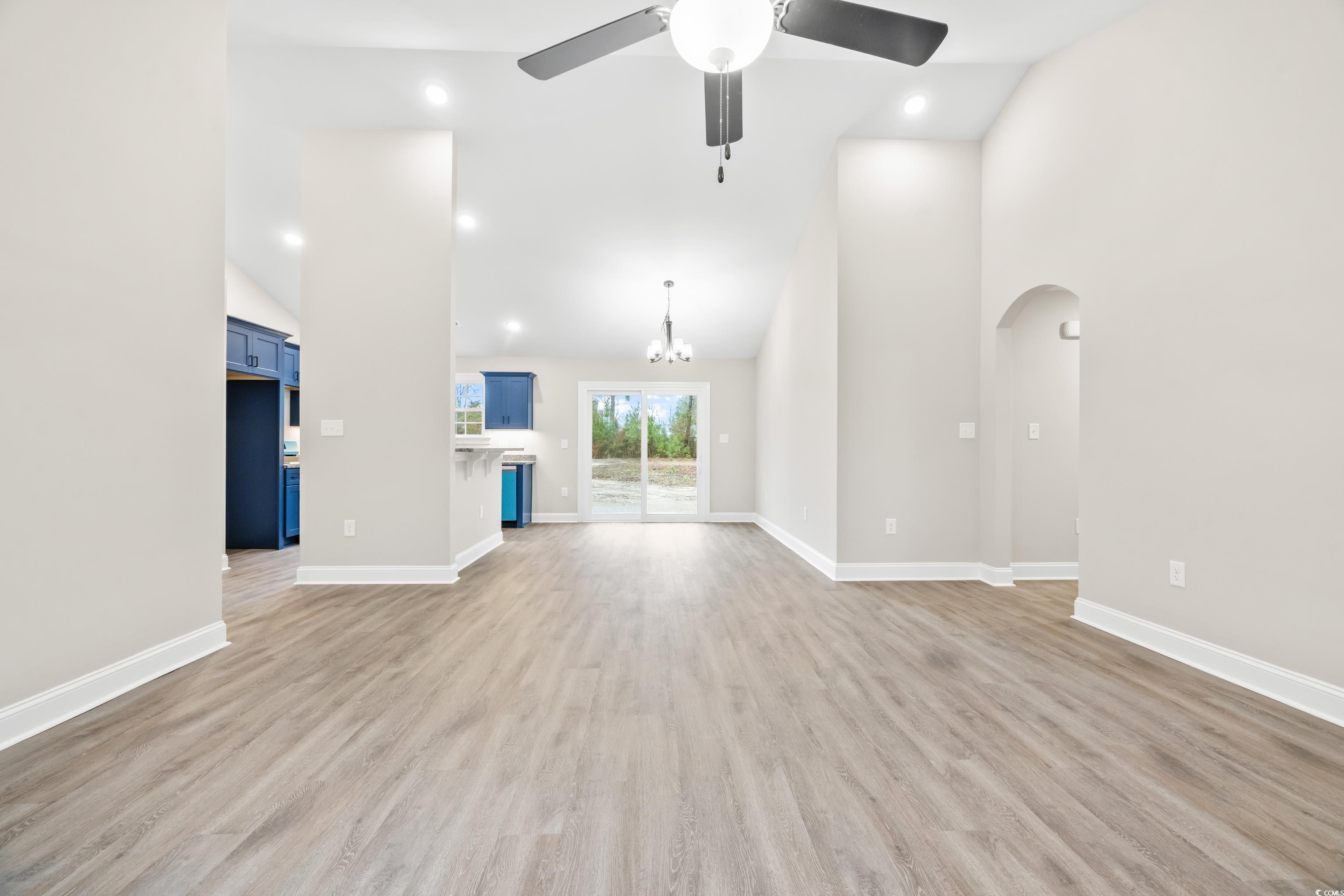 3646 Bethel Chapel Road Loris, SC 29569 - Photo 10 of 40 Unfurnished living room with high vaulted ceiling, a chandelier, light wood finished floors, a ceiling fan, and recessed lighting