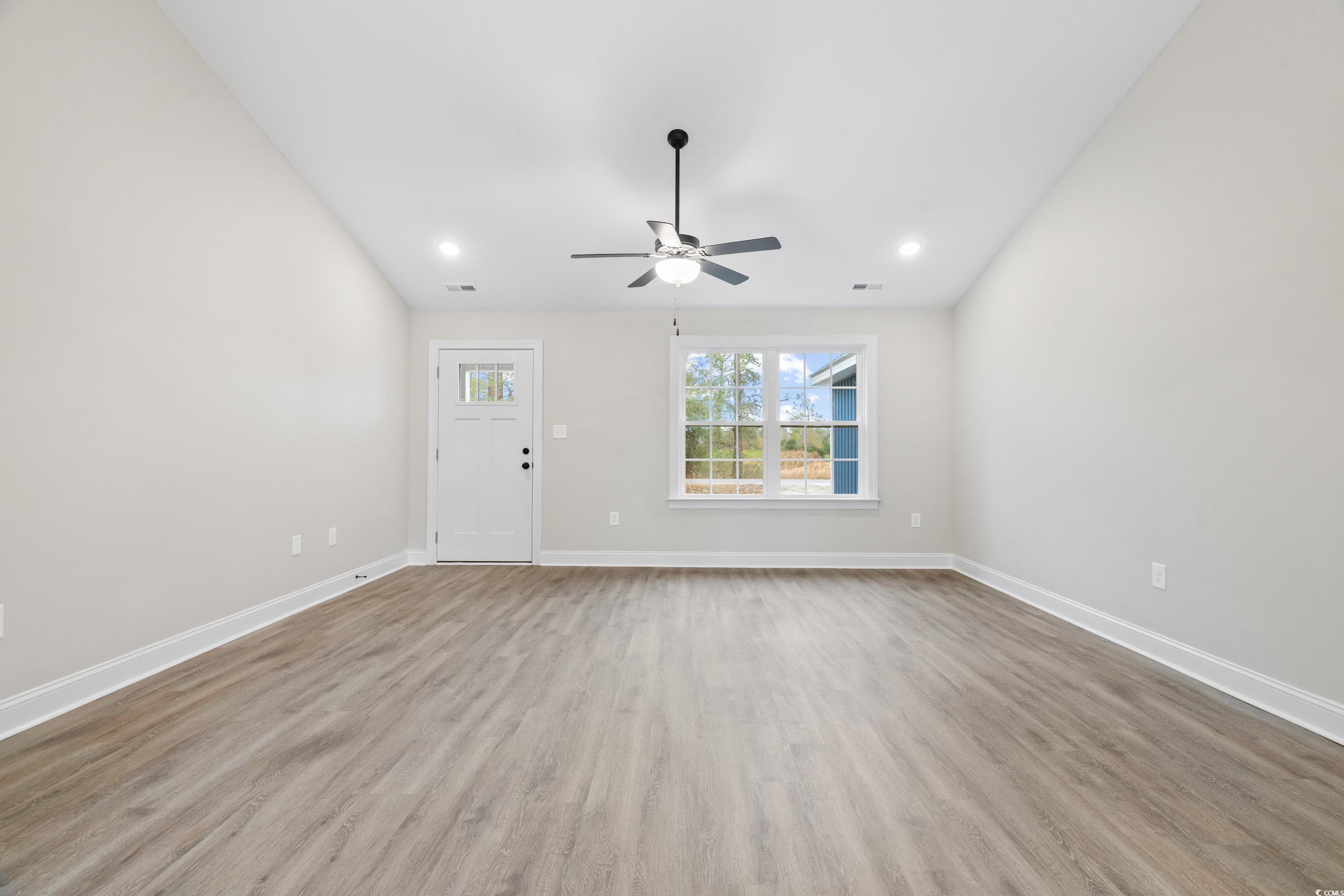 3646 Bethel Chapel Road Loris, SC 29569 - Photo 12 of 40 Unfurnished living room with light wood-style flooring and a ceiling fan