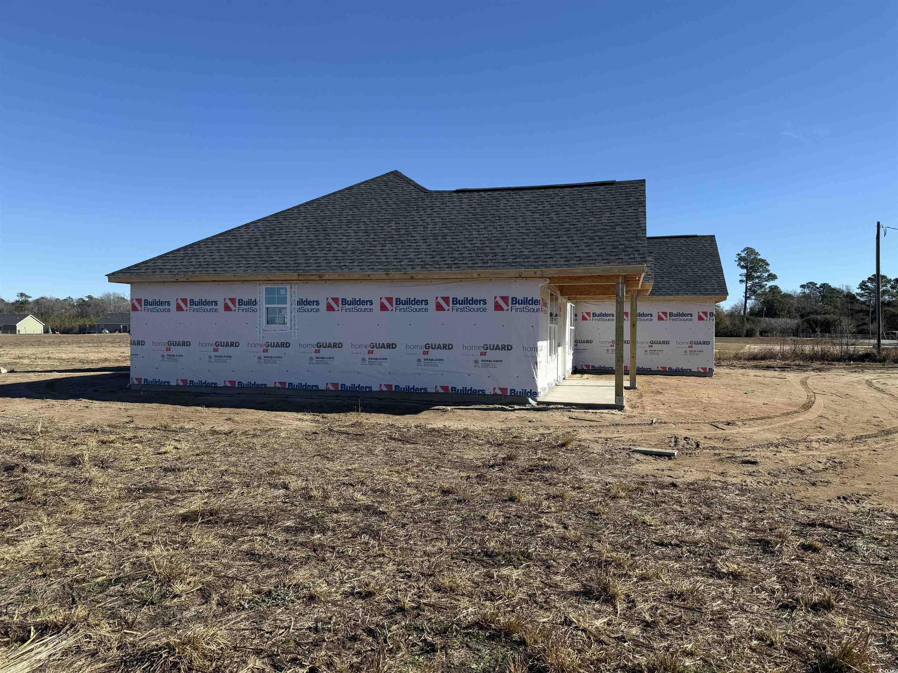 3646 Bethel Chapel Road Loris, SC 29569 - Photo 3 of 40 View of side of home featuring roof with shingles