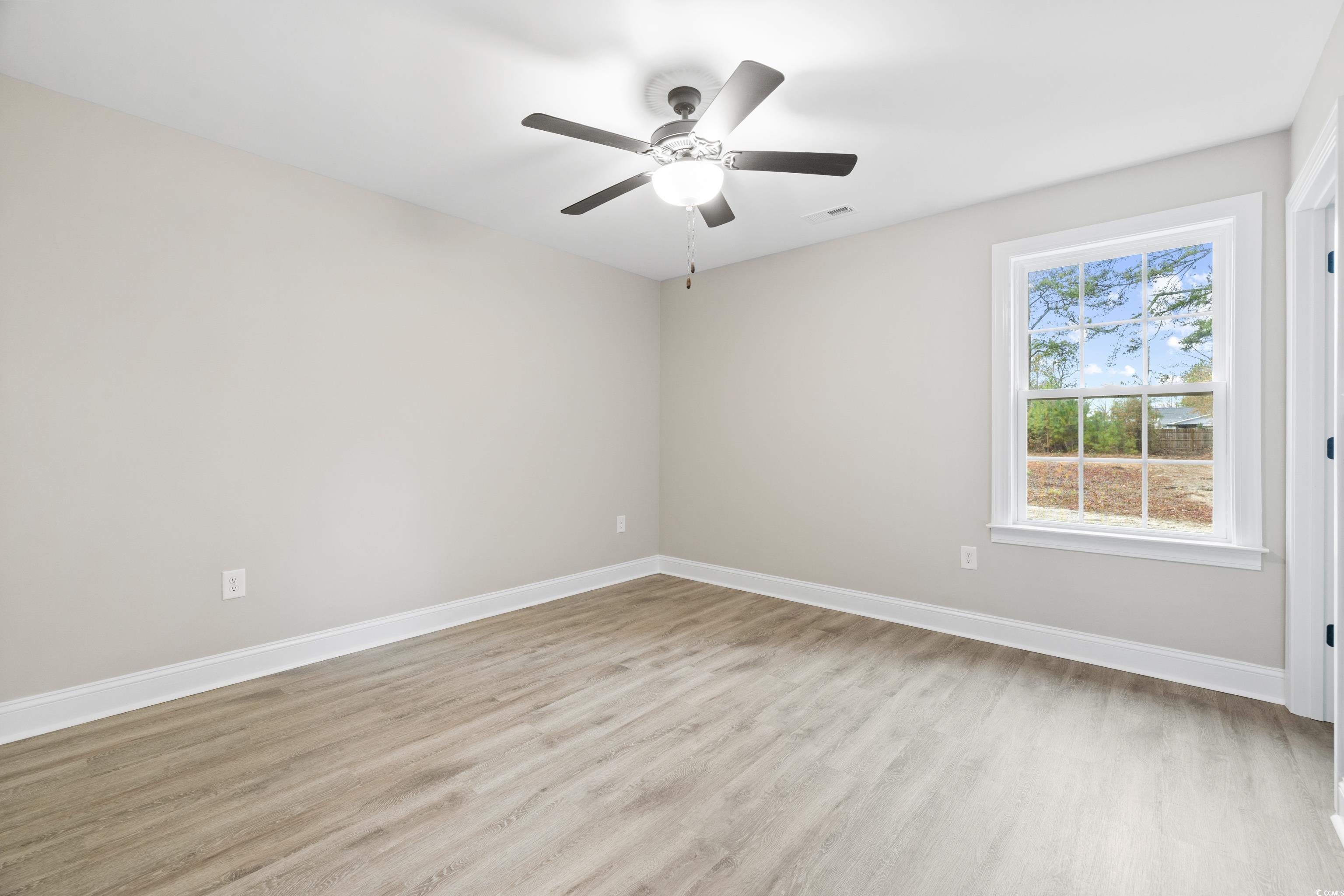 3646 Bethel Chapel Road Loris, SC 29569 - Photo 35 of 40 Spare room with light wood-style floors and ceiling fan