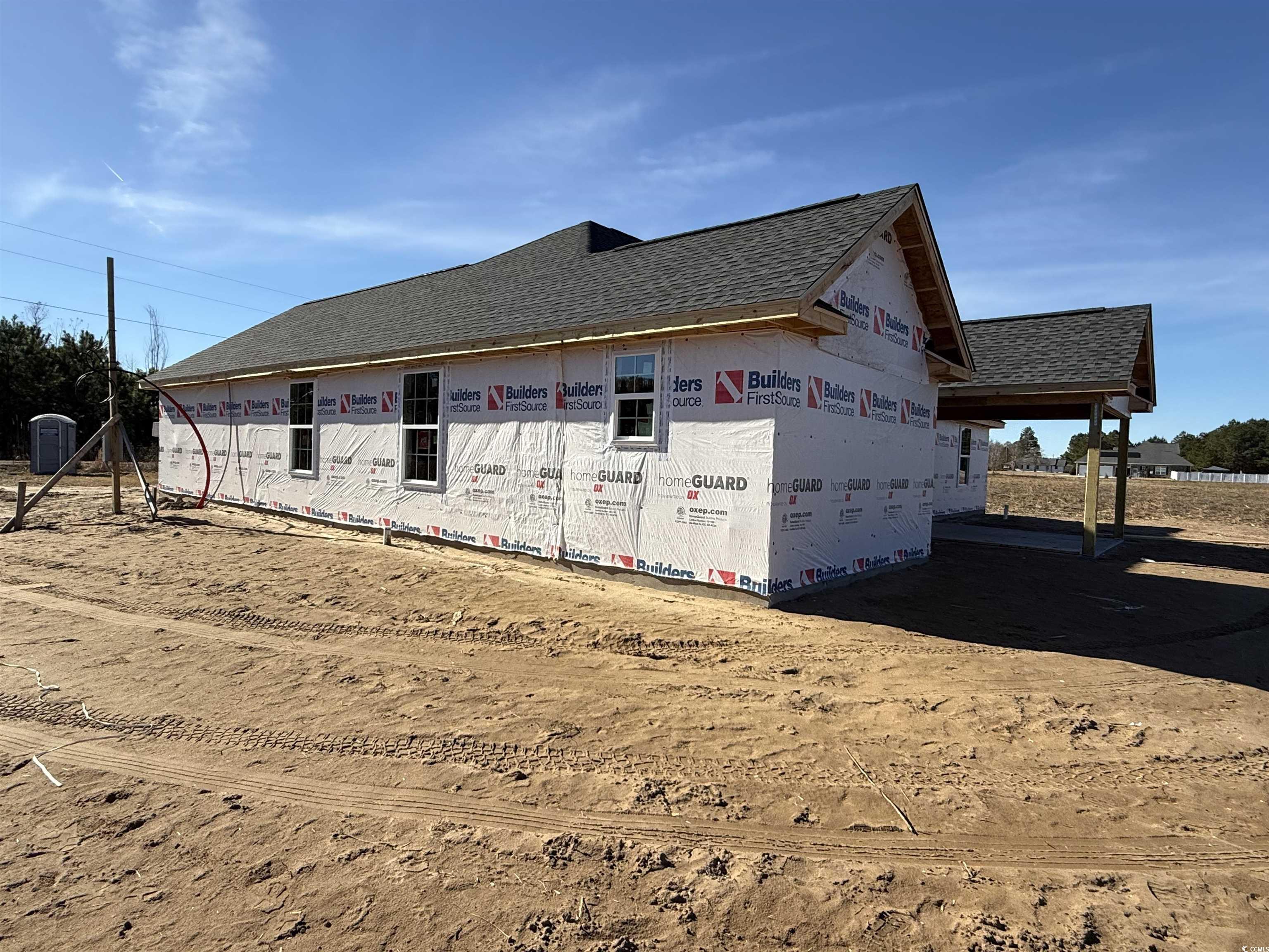 3646 Bethel Chapel Road Loris, SC 29569 - Photo 6 of 40 View of home's exterior with a shingled roof