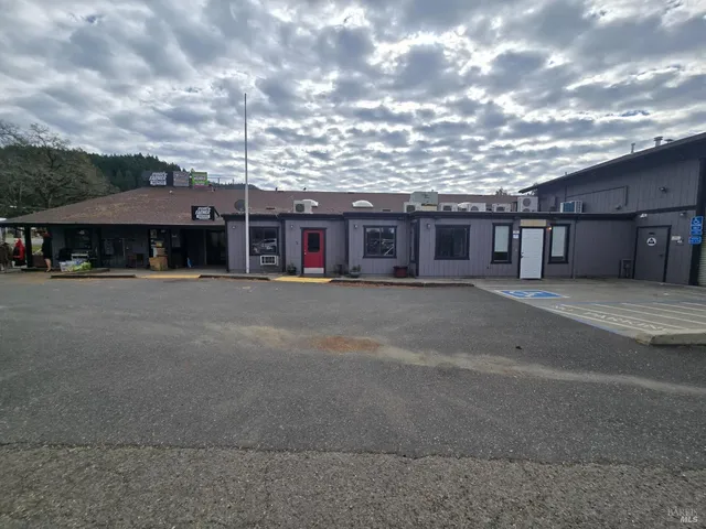 a view of a house next to a big yard