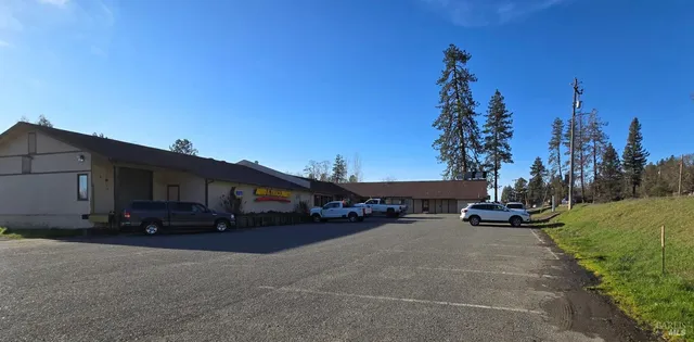 a car parked in front of white house