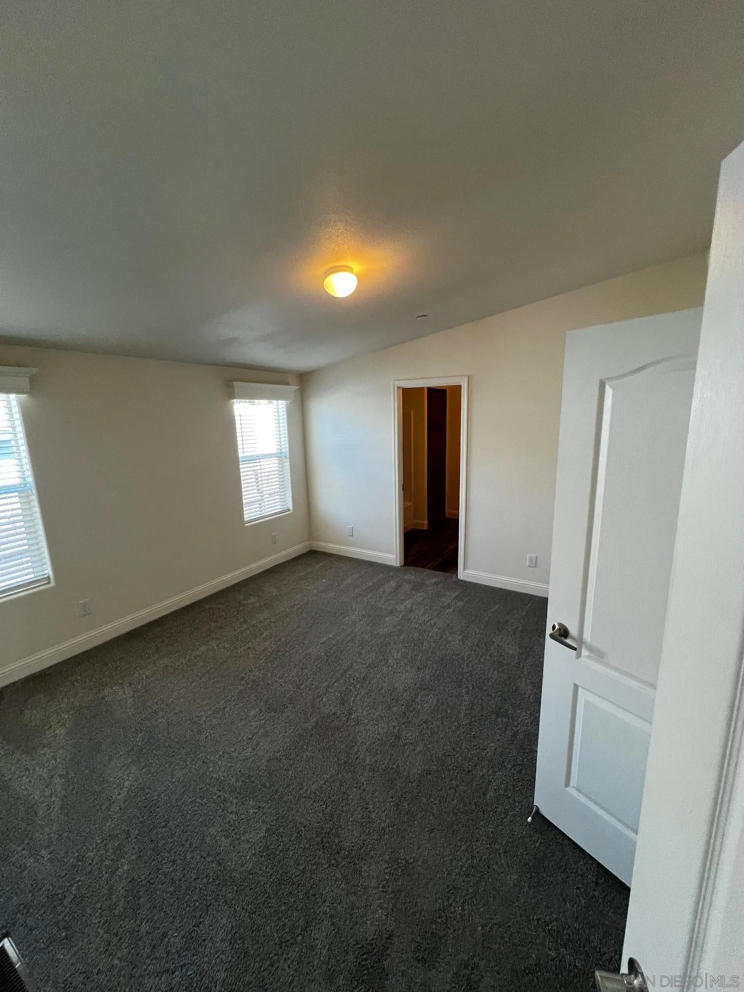 8975 Lamar Street Spring Valley, CA 91977 - Photo 13 of 59 a view of an empty room and window