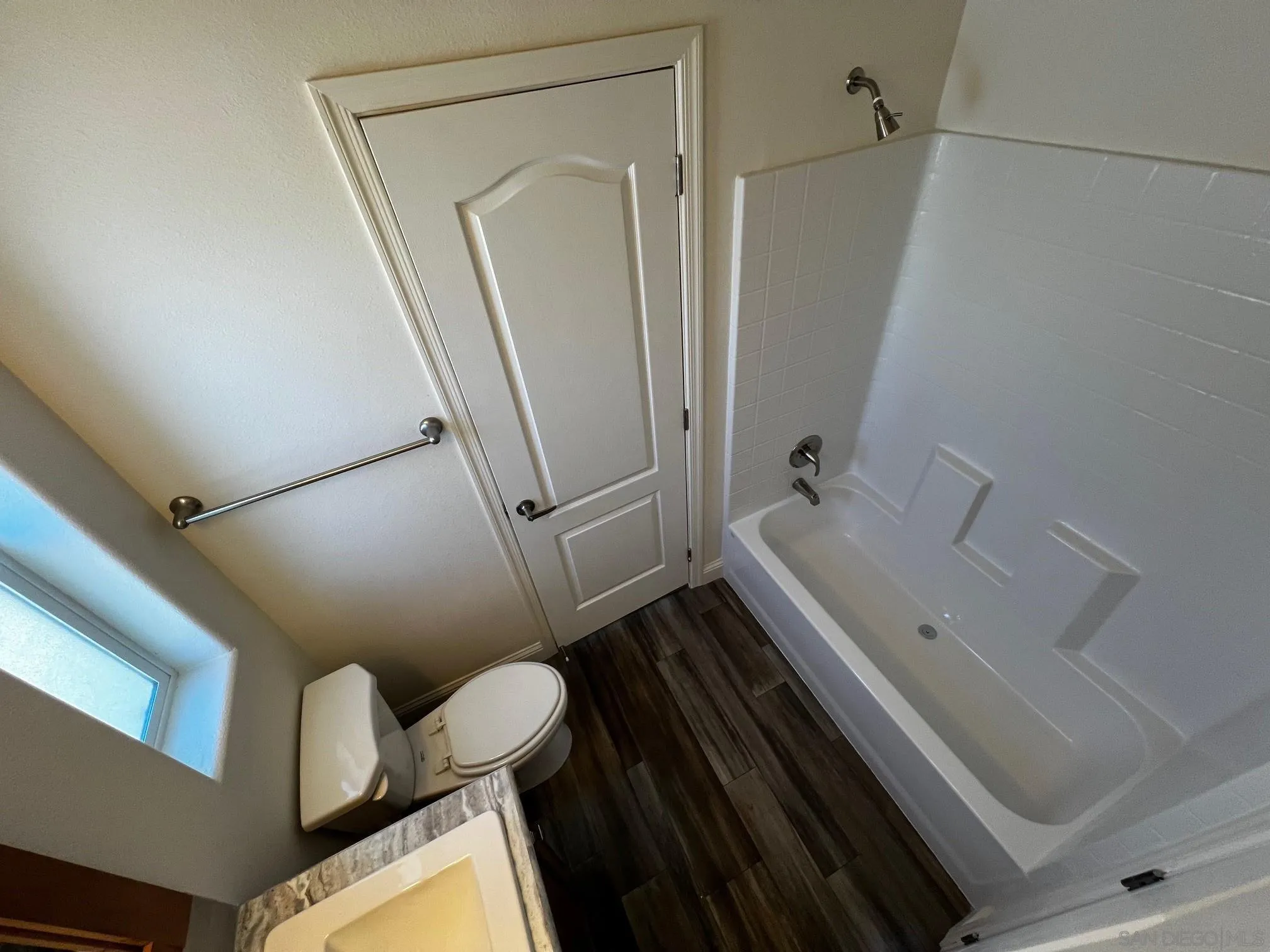 8975 Lamar Street Spring Valley, CA 91977 - Photo 14 of 59 a bathroom with a bathtub