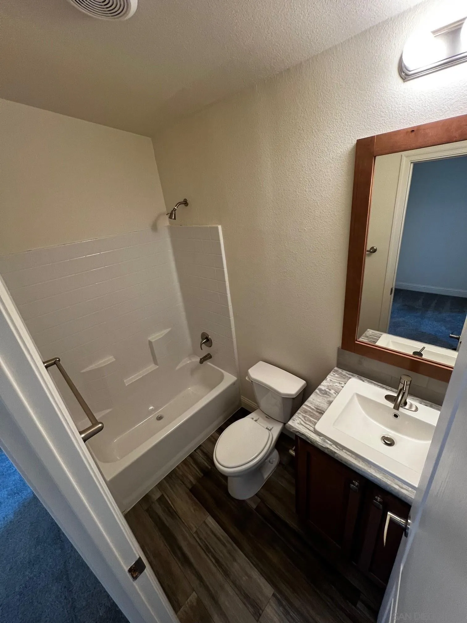 8975 Lamar Street Spring Valley, CA 91977 - Photo 15 of 59 a bathroom with a sink mirror and toilet
