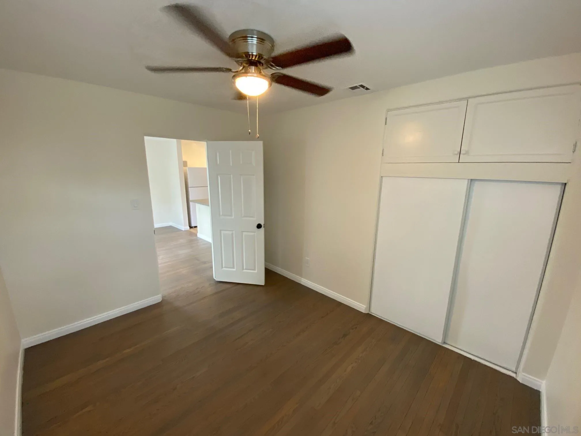 8975 Lamar Street Spring Valley, CA 91977 - Photo 23 of 59 an empty room with a fan and a ceiling fan