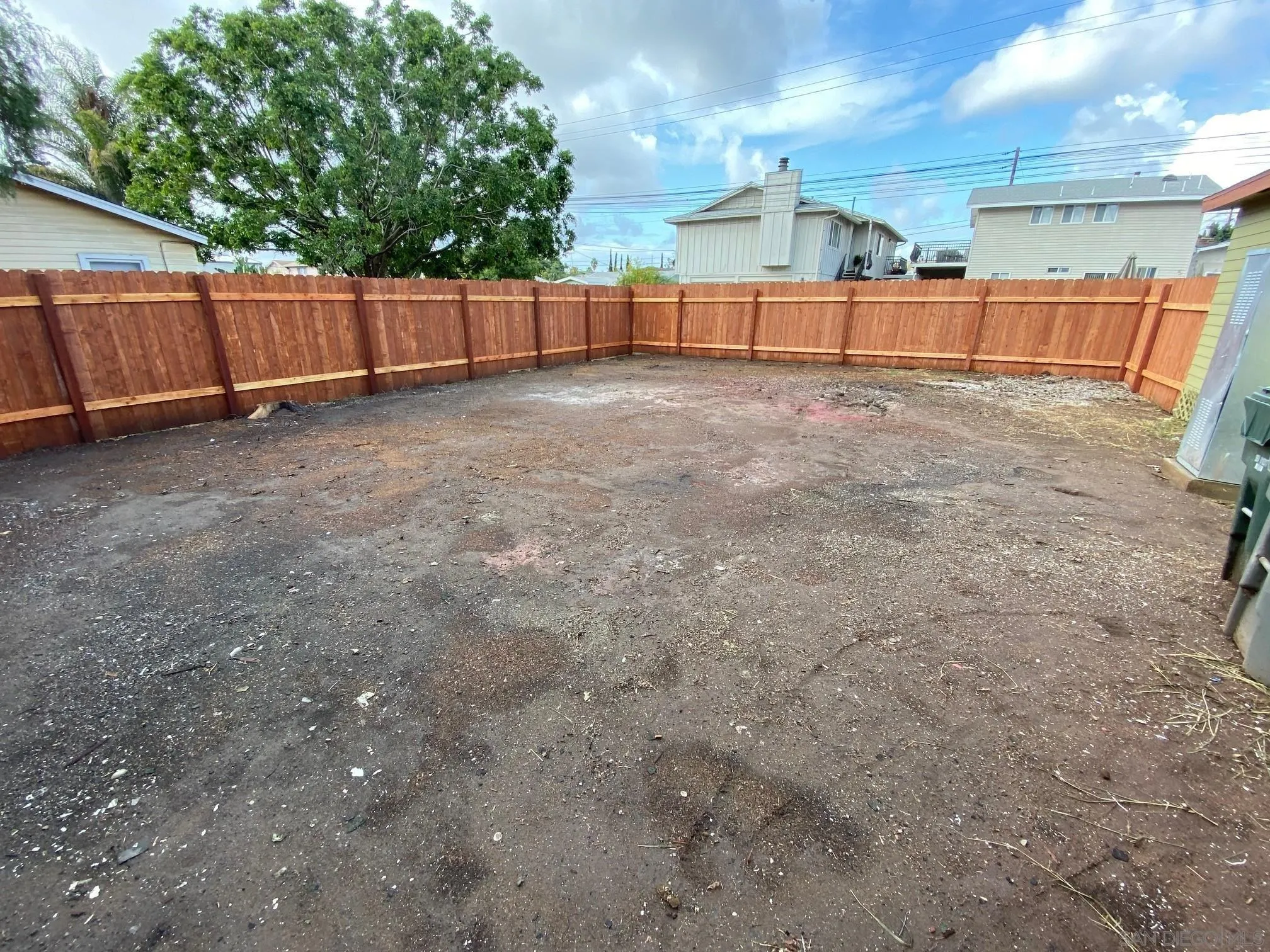8975 Lamar Street Spring Valley, CA 91977 - Photo 32 of 59 a view of a yard with wooden fence