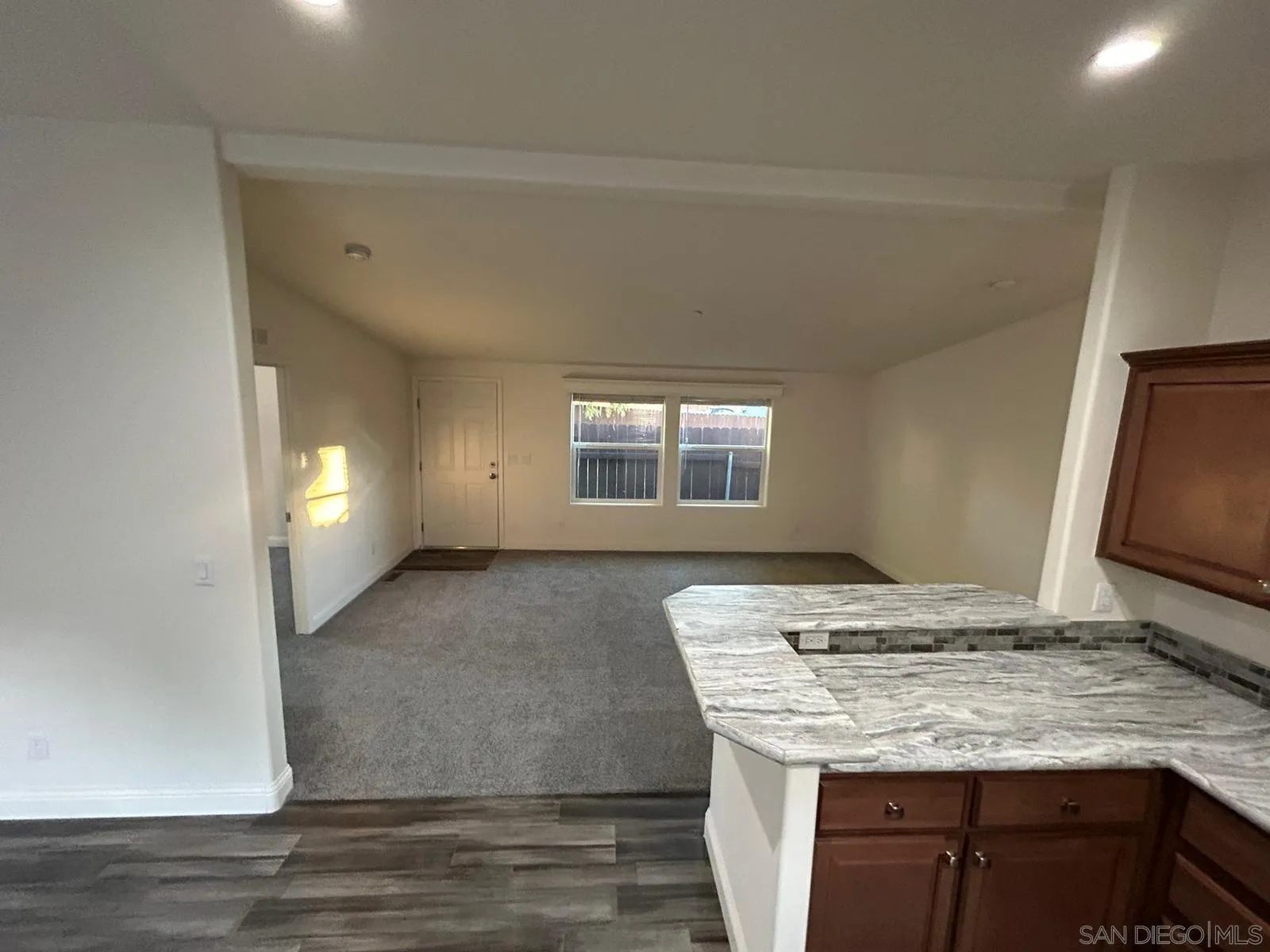8975 Lamar Street Spring Valley, CA 91977 - Photo 36 of 59 a view of a kitchen counter space and wooden floor