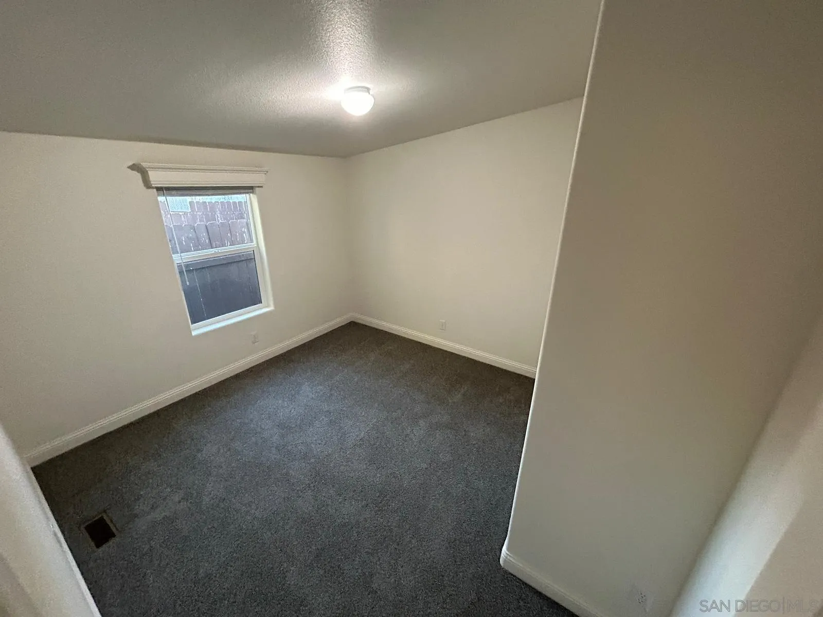 8975 Lamar Street Spring Valley, CA 91977 - Photo 43 of 59 an empty room with a workbench