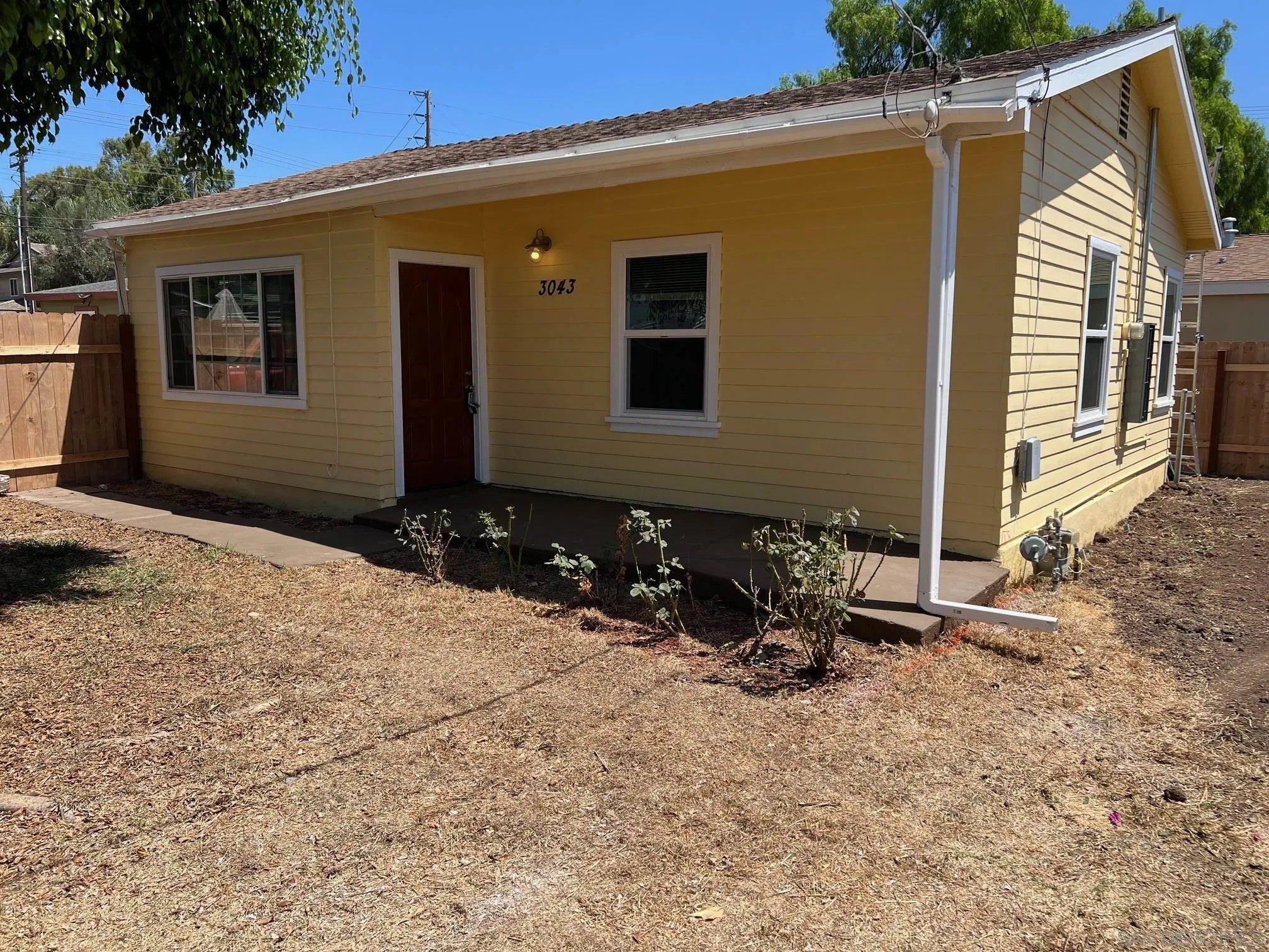 8975 Lamar Street Spring Valley, CA 91977 - Photo 50 of 59 a backyard of a house with table and chairs