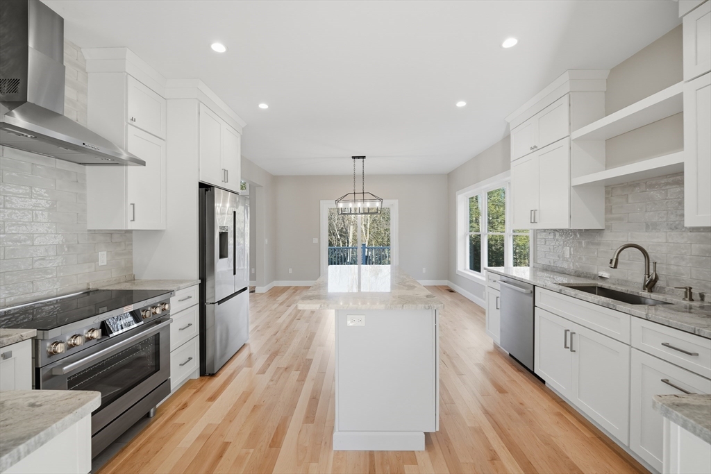 130 Linden Ridge Road Amherst, MA 01002 - Photo 12 of 40 a kitchen with stainless steel appliances granite countertop a sink stove and refrigerator