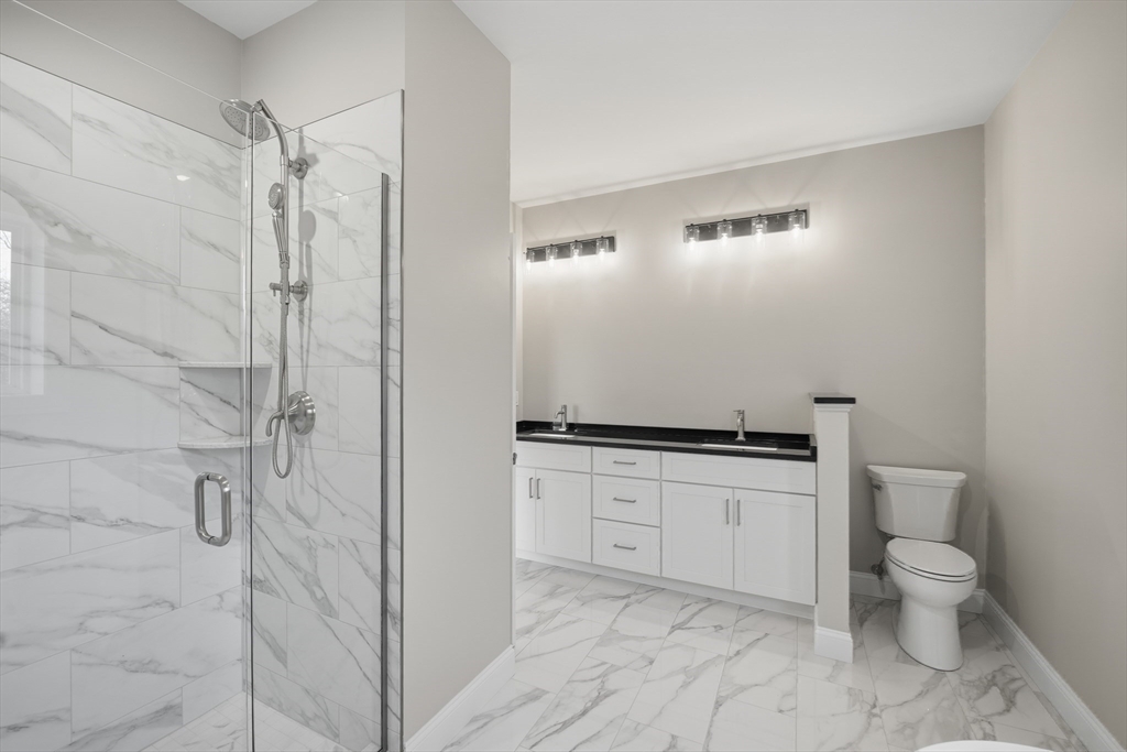 130 Linden Ridge Road Amherst, MA 01002 - Photo 16 of 40 a bathroom with a granite countertop sink toilet and shower