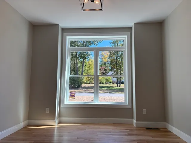 a view of entryway with wooden floor