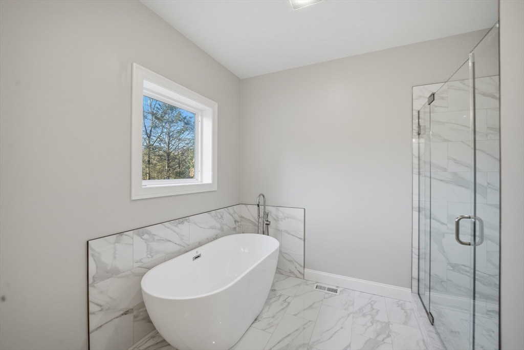 130 Linden Ridge Road Amherst, MA 01002 - Photo 17 of 40 a view of a bathtub in a bathroom
