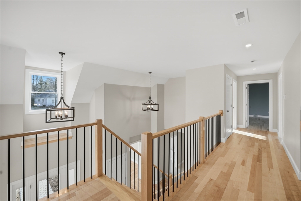 130 Linden Ridge Road Amherst, MA 01002 - Photo 23 of 40 a view of a hallway with wooden floor and staircase