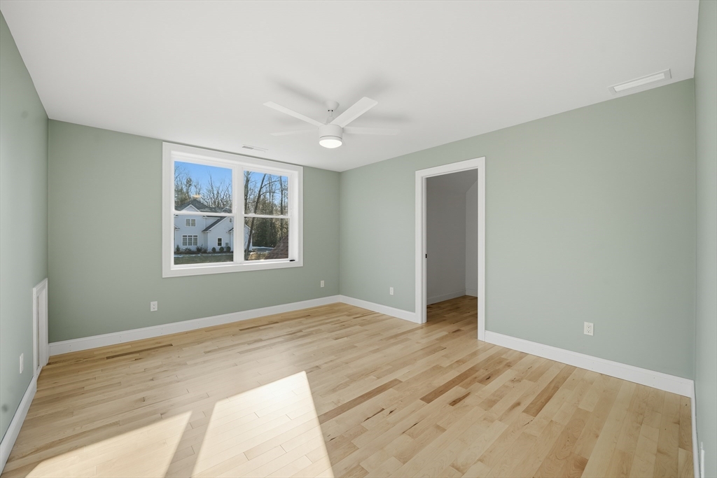130 Linden Ridge Road Amherst, MA 01002 - Photo 27 of 40 a view of an empty room with window and wooden floor