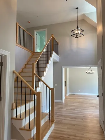 a view of an entryway with wooden floor