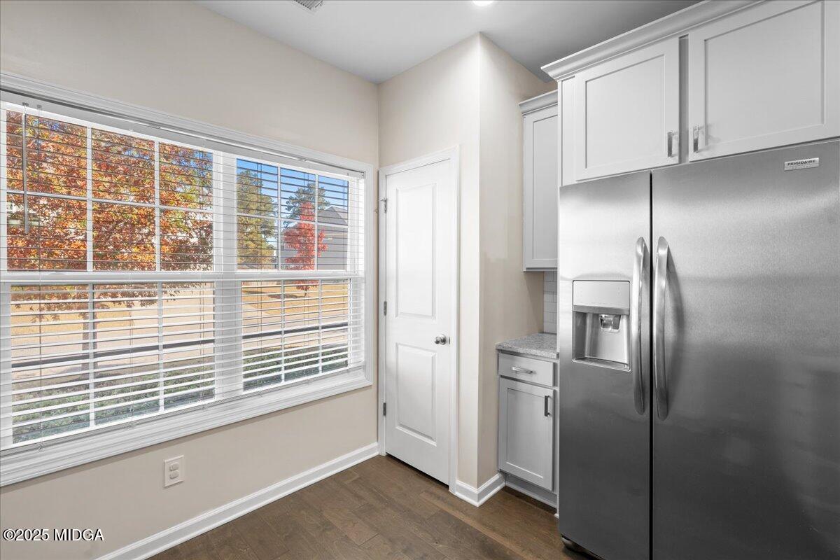 108 East E River Perry, GA 31069 - Photo 14 of 38 a view of a refrigerator in kitchen and an empty room