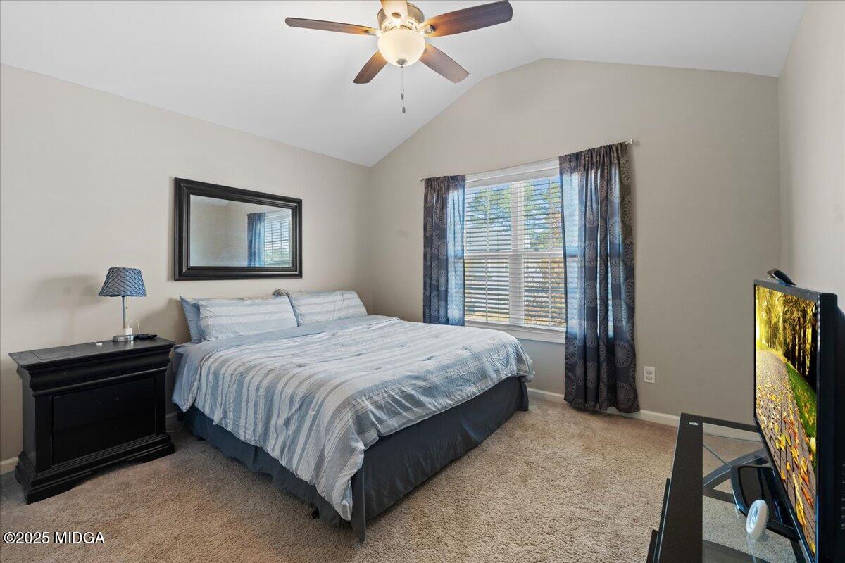 108 East E River Perry, GA 31069 - Photo 20 of 38 a bedroom with a bed and a window