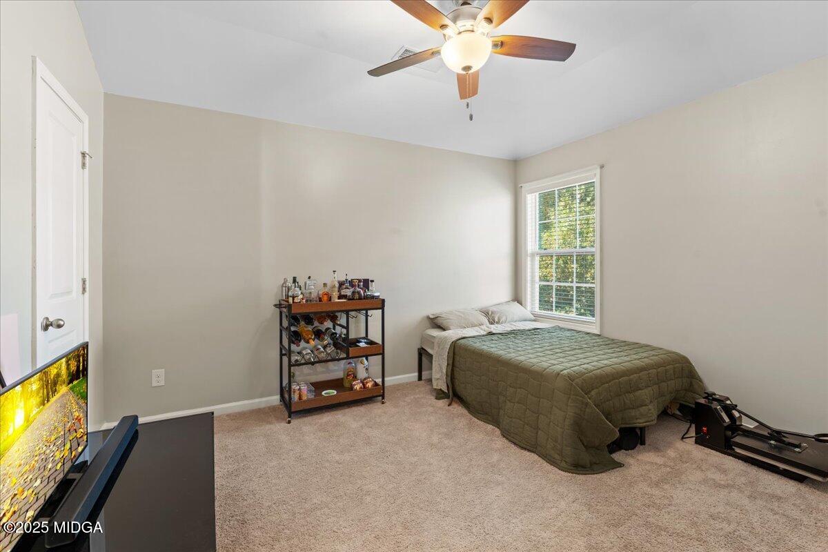 108 East E River Perry, GA 31069 - Photo 22 of 38 a bedroom with a bed and a window