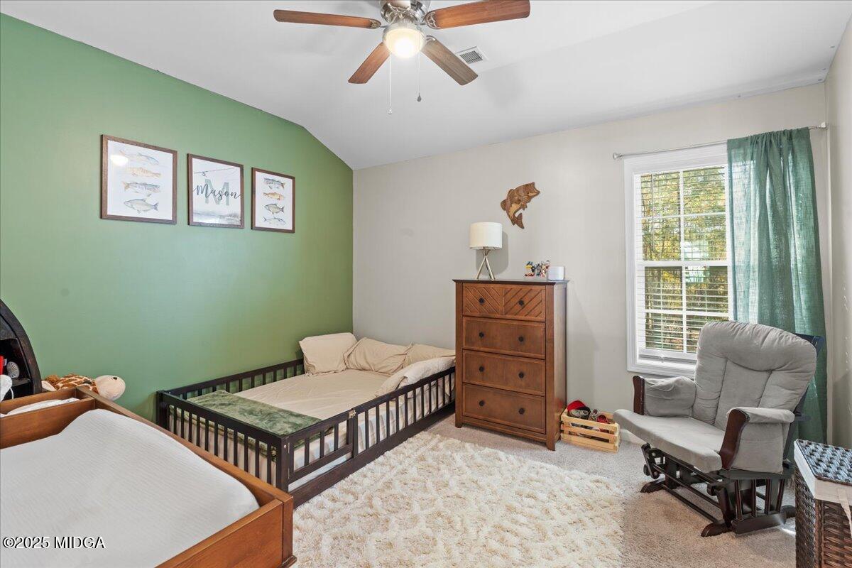 108 East E River Perry, GA 31069 - Photo 23 of 38 a bedroom with furniture and a window