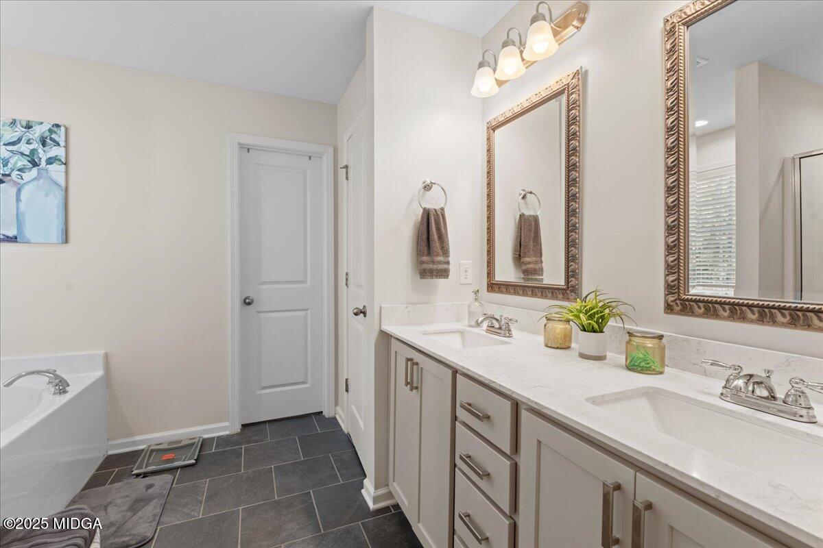 108 East E River Perry, GA 31069 - Photo 28 of 38 a bathroom with a double vanity sink mirror and double