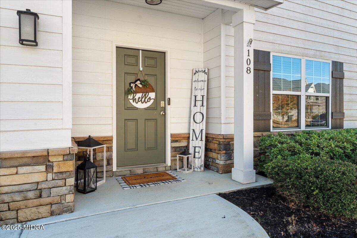 108 East E River Perry, GA 31069 - Photo 3 of 38 a front view of a house with parking