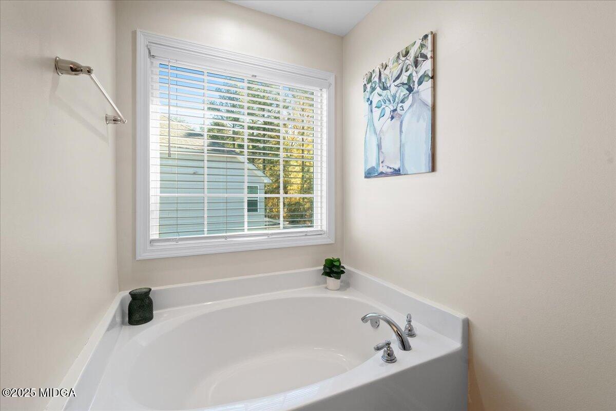 108 East E River Perry, GA 31069 - Photo 31 of 38 a white bath tub sitting next to a window