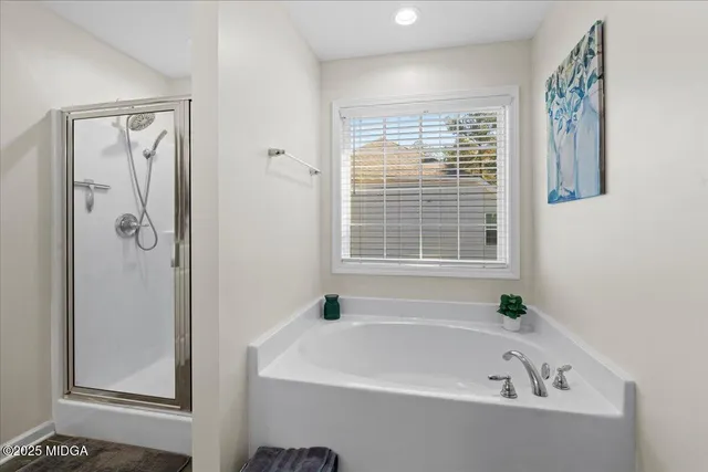 a white bath tub sitting next to a window