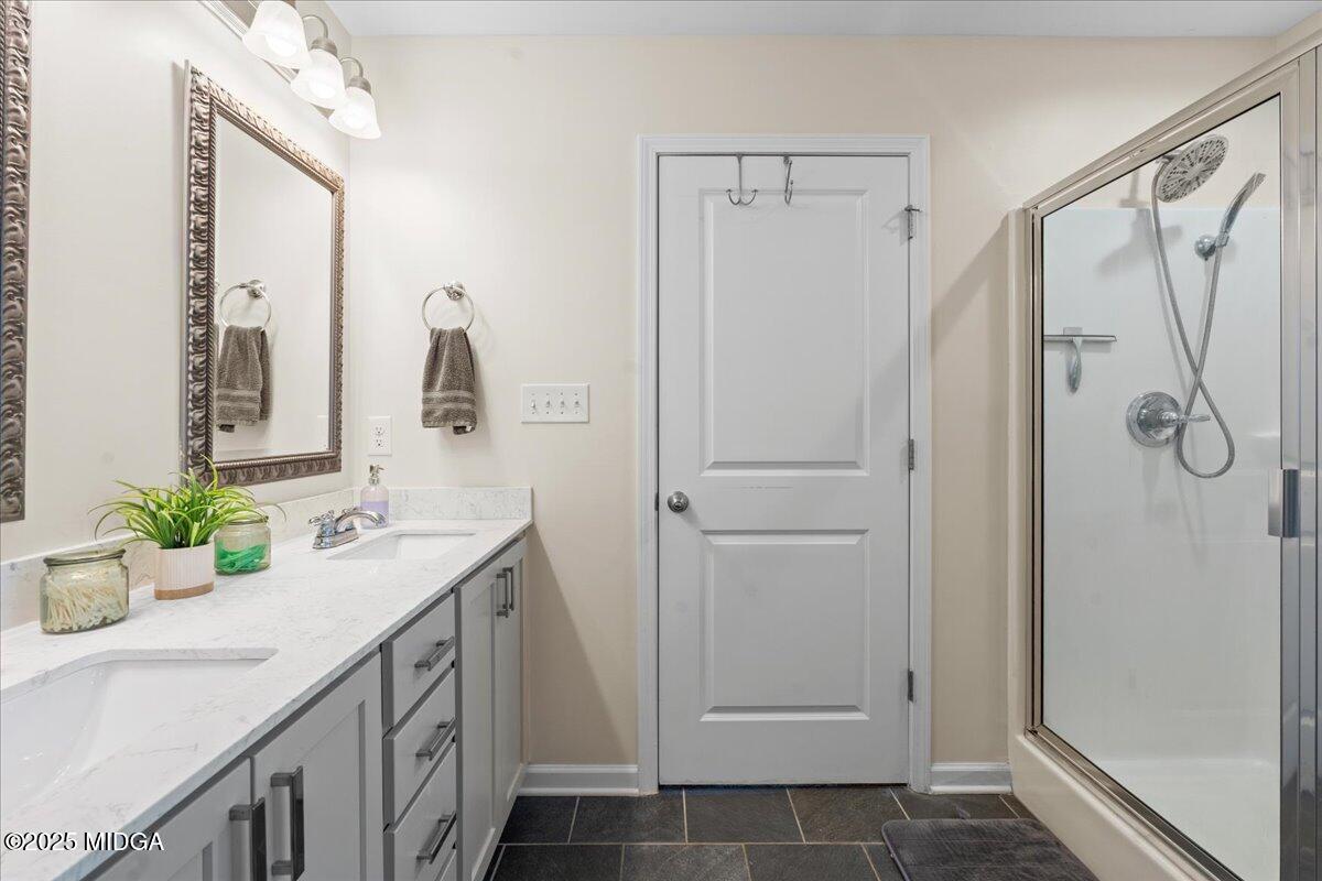 108 East E River Perry, GA 31069 - Photo 33 of 38 a bathroom with a double vanity sink mirror and shower