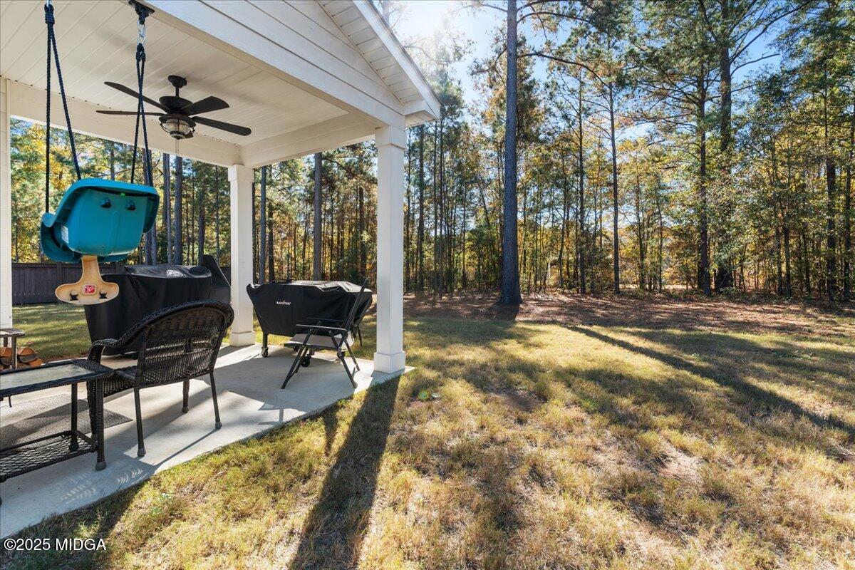 108 East E River Perry, GA 31069 - Photo 36 of 38 a backyard of a house with table and chairs