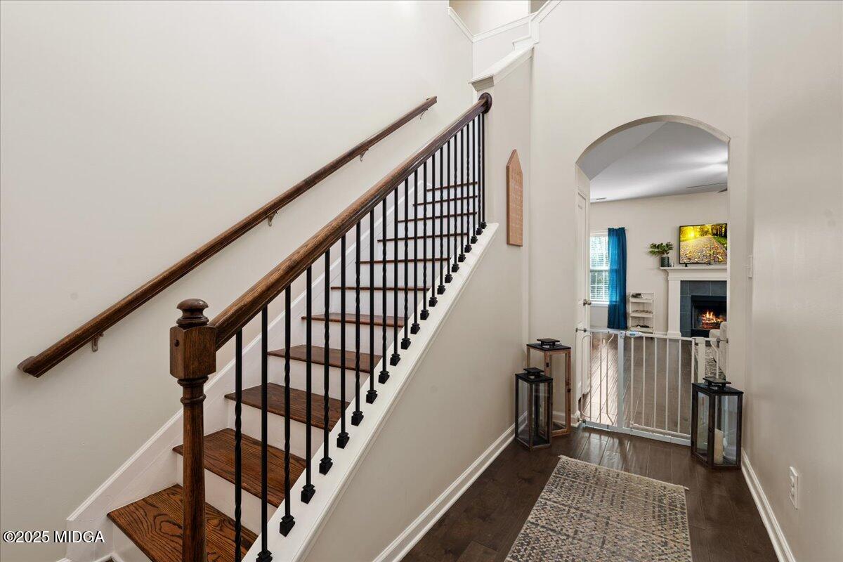 108 East E River Perry, GA 31069 - Photo 4 of 38 a view of staircase with wooden floor and a rug