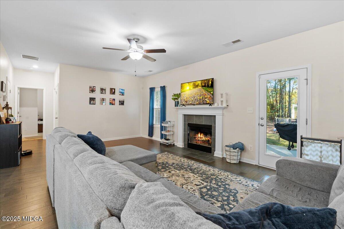 108 East E River Perry, GA 31069 - Photo 7 of 38 a living room with furniture a flat screen tv and a fireplace